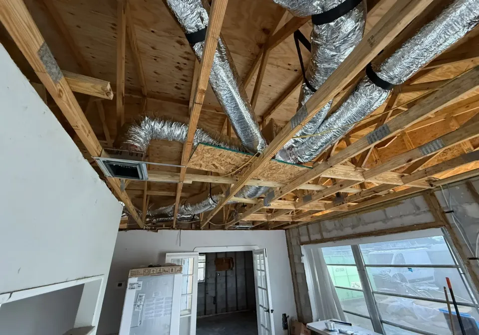 Residential HVAC ductwork installation in a home, showcasing the setup of ducts in preparation for efficient air circulation and cooling.