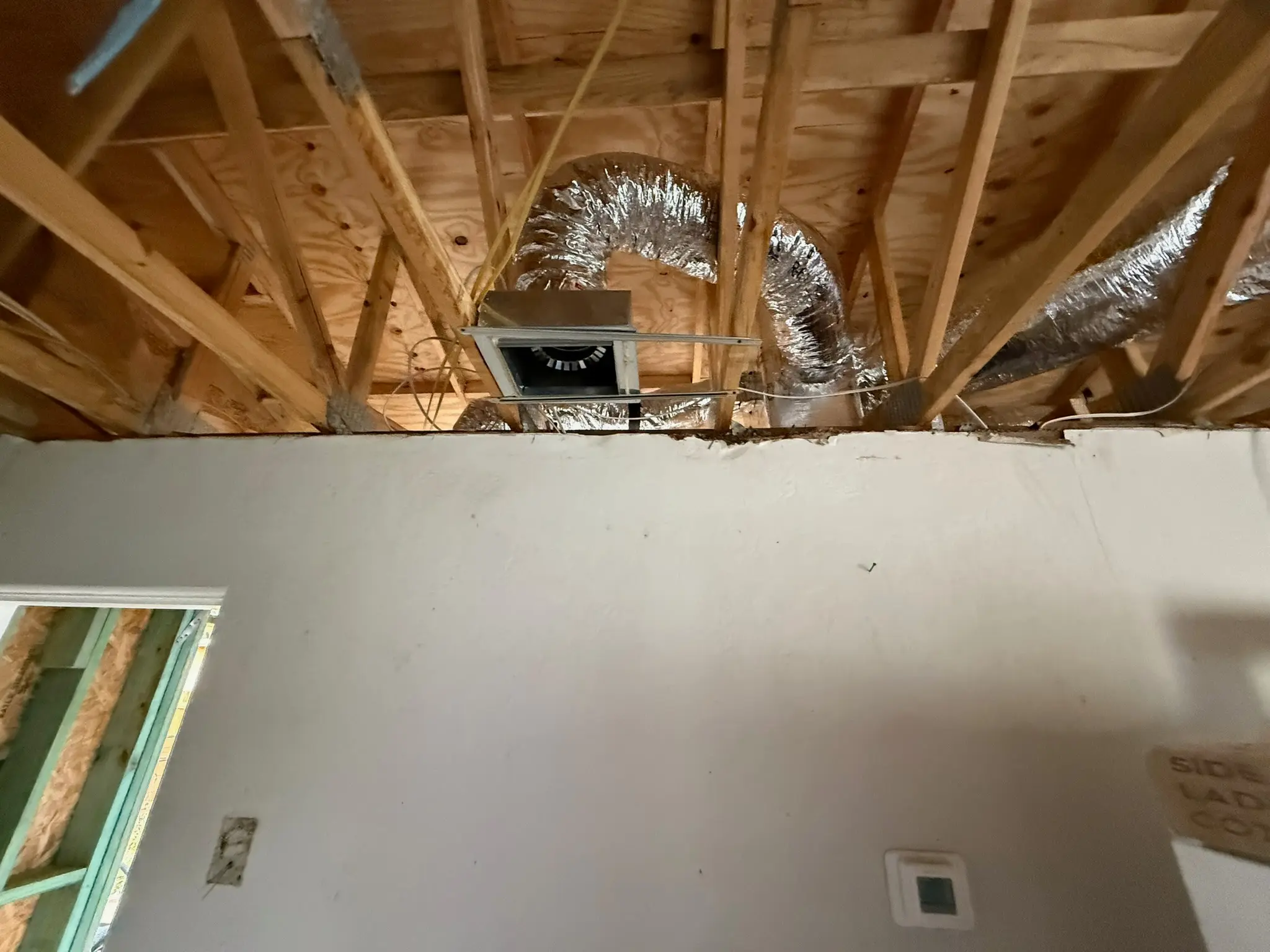 Ductwork installation in residential ceiling for HVAC system in St. Petersburg, FL."