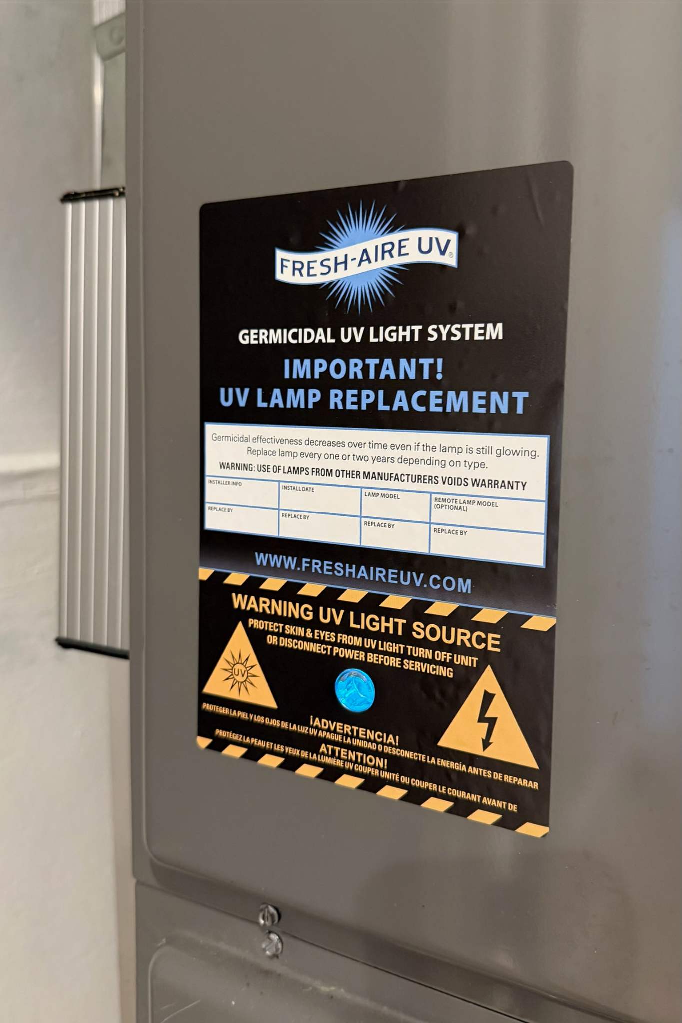 Fresh-Aire UV light system warning label for lamp replacement, with safety instructions for UV light servicing.