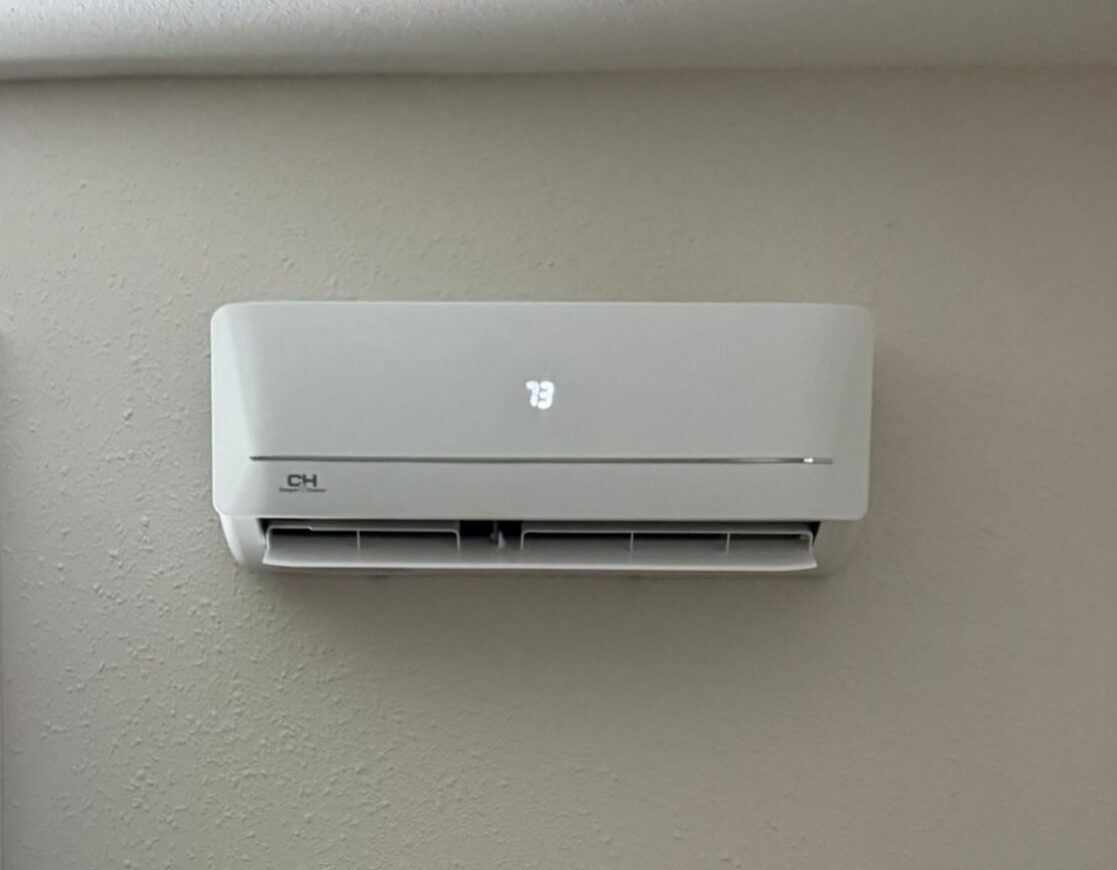 Mitsubishi mini-split indoor unit installed on a wall in a residential home, providing efficient and quiet cooling.